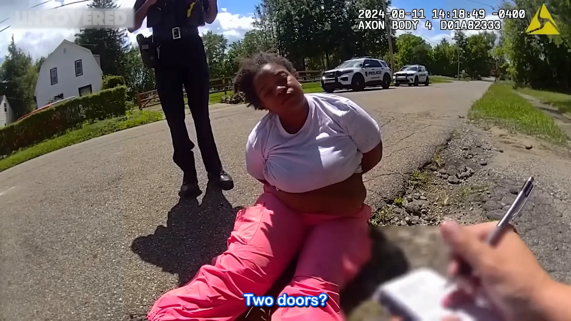 Officer questioning the suspect about their vehicle